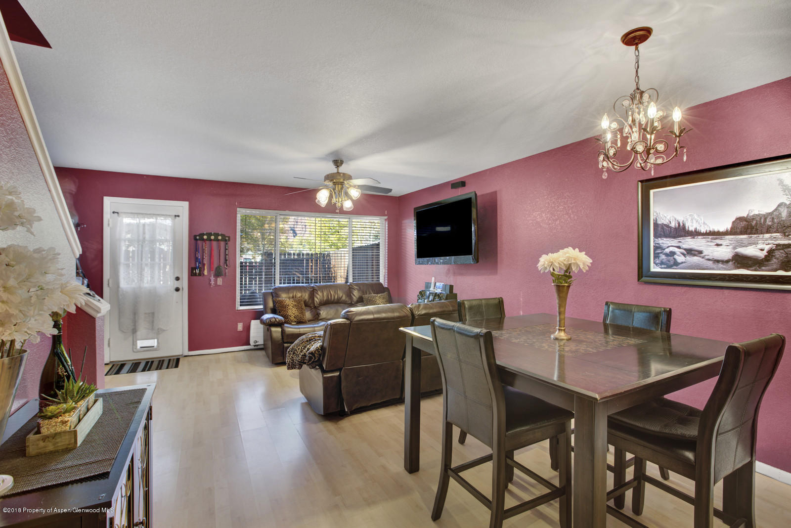 323 Park Avenue, Unit G2 Basalt, CO 81621 - Photo 4 of 16 a view of a dining room with furniture wooden floor and chandelier