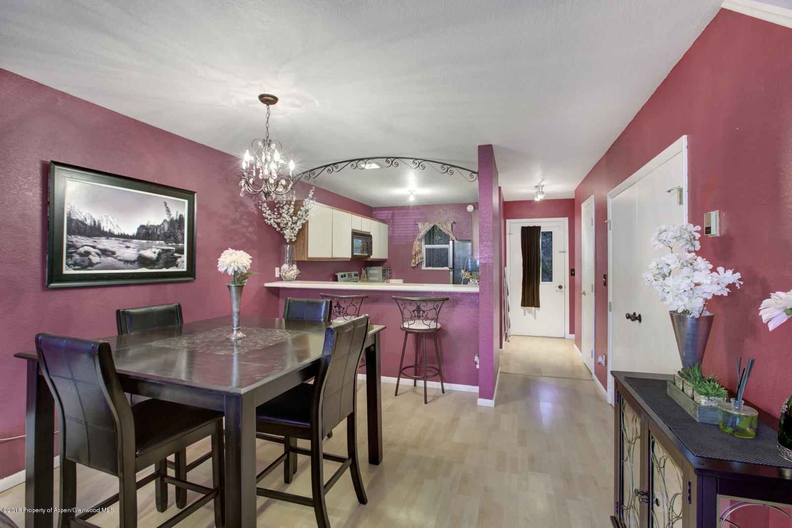 323 Park Avenue, Unit G2 Basalt, CO 81621 - Photo 5 of 16 a view of a dining room with furniture and chandelier