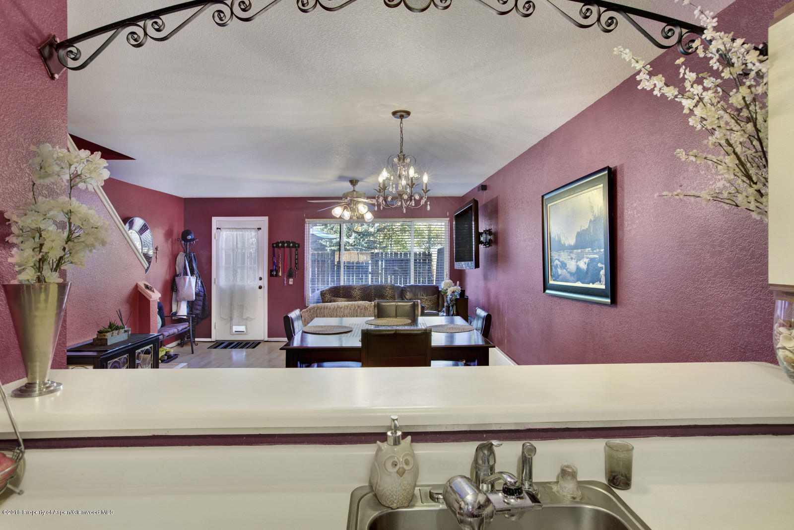 323 Park Avenue, Unit G2 Basalt, CO 81621 - Photo 7 of 16 a view of a dining room with furniture and chandelier