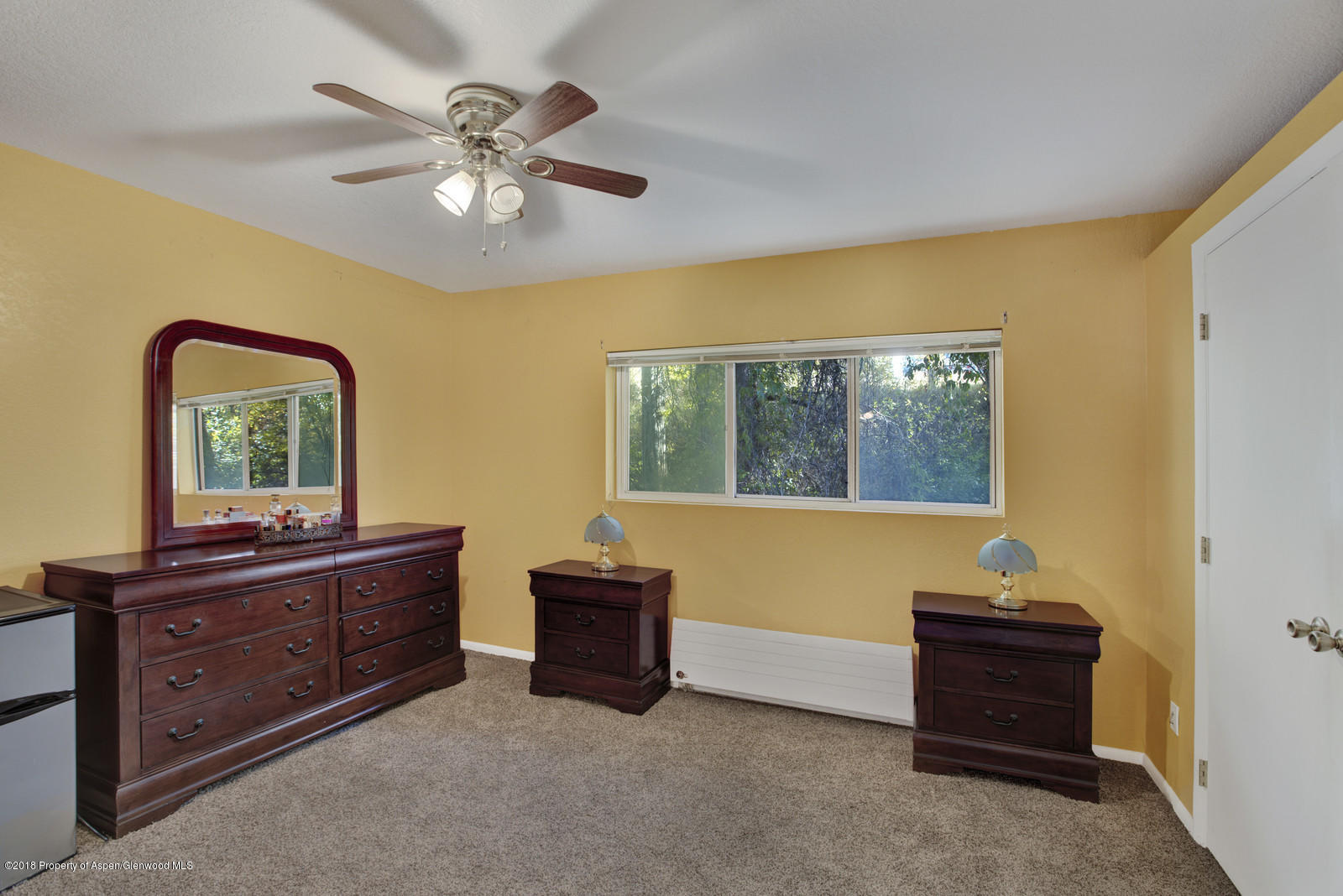 323 Park Avenue, Unit G2 Basalt, CO 81621 - Photo 10 of 16 a room with furniture and a window