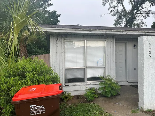 a view of a wooden door of the house