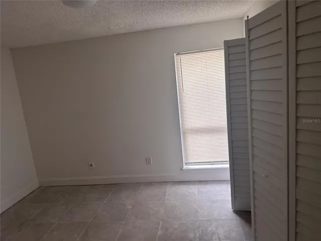 a view of empty room with a window