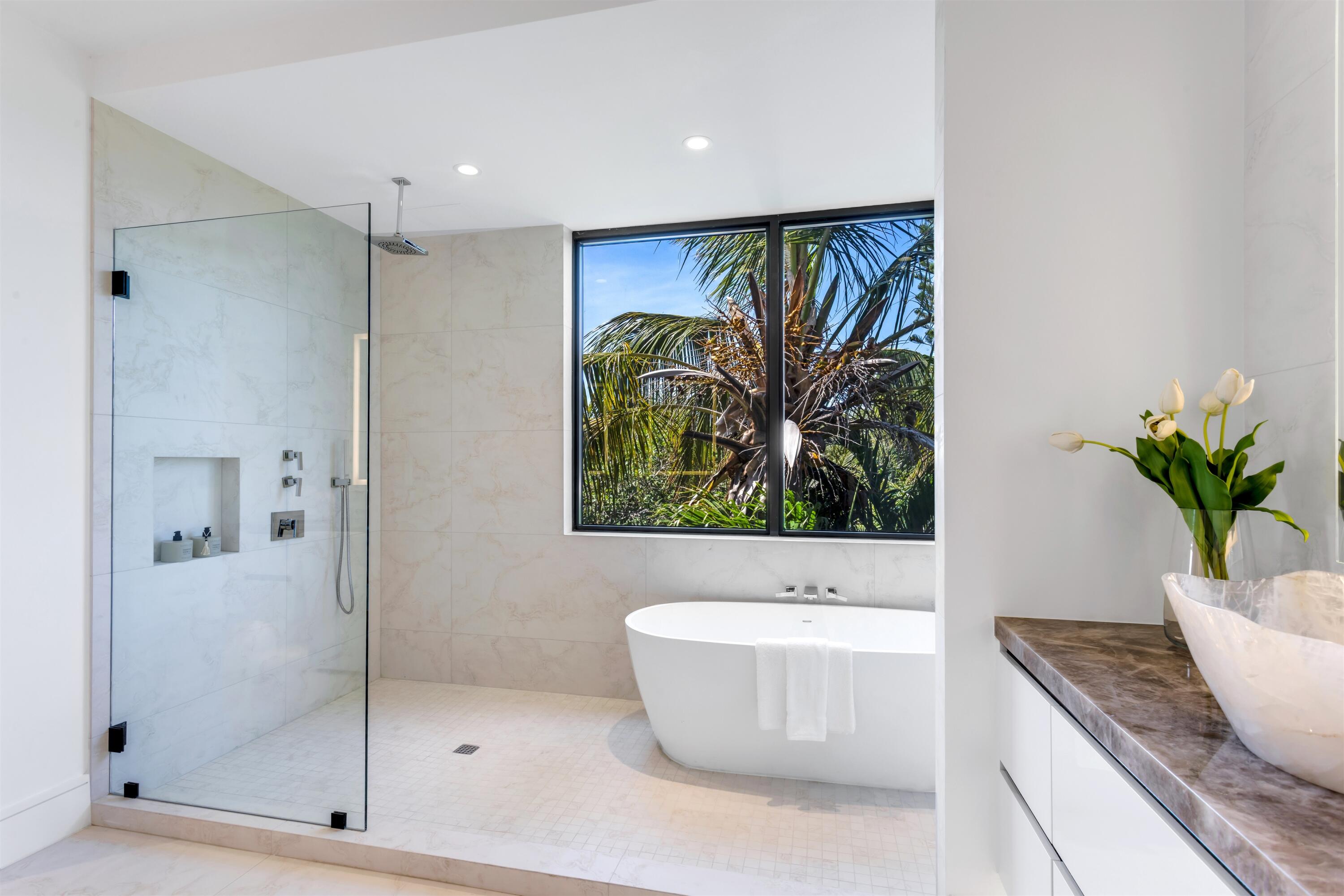 900 Lago Mar Lane, Unit PH Boca Raton, FL 33431 - Photo 25 of 58 a bathroom with a bathtub and a shower