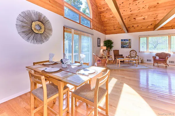 a kitchen with stainless steel appliances kitchen island granite countertop a stove top oven a sink a counter space and cabinets