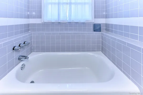 a bathroom with a sink a toilet and bathtub