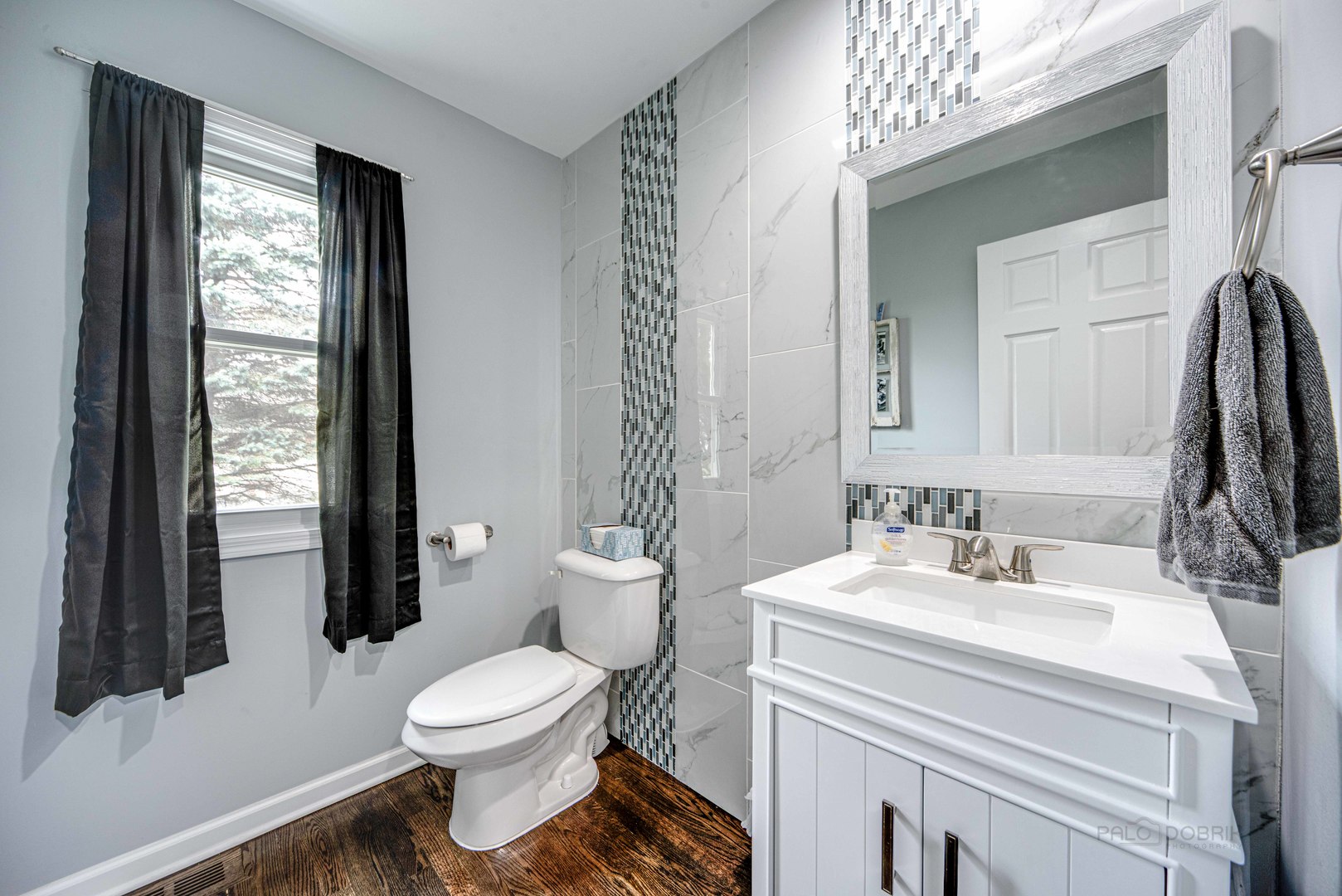 1603 Elm Street Spring Grove, IL 60081 - Photo 13 of 38 a bathroom with a toilet sink and mirror