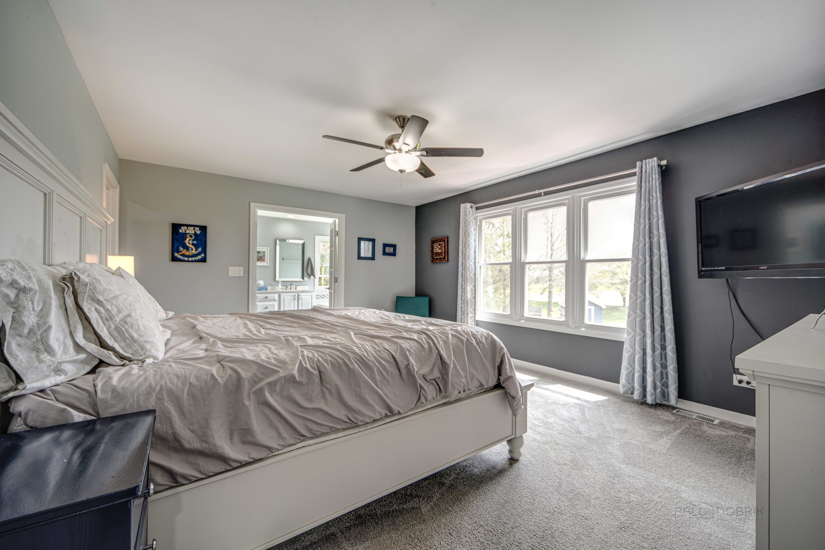 1603 Elm Street Spring Grove, IL 60081 - Photo 17 of 38 a spacious bedroom with a bed and glass windows
