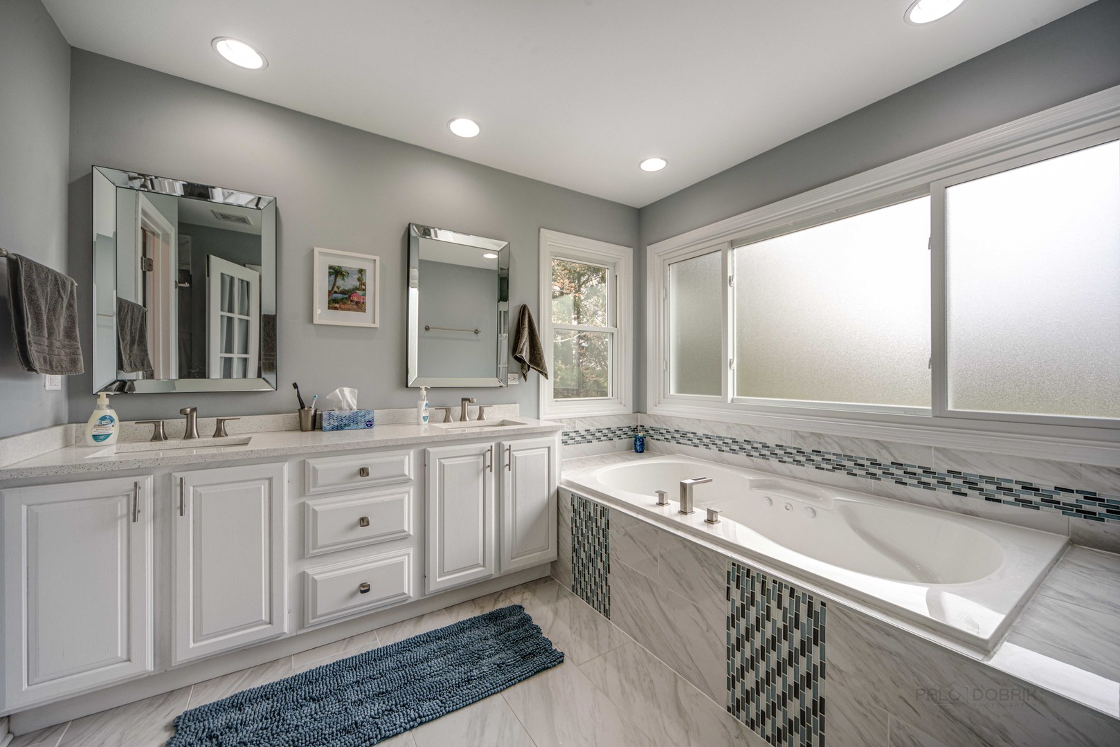 1603 Elm Street Spring Grove, IL 60081 - Photo 19 of 38 a spacious bathroom with a large mirror vanity and a bathtub