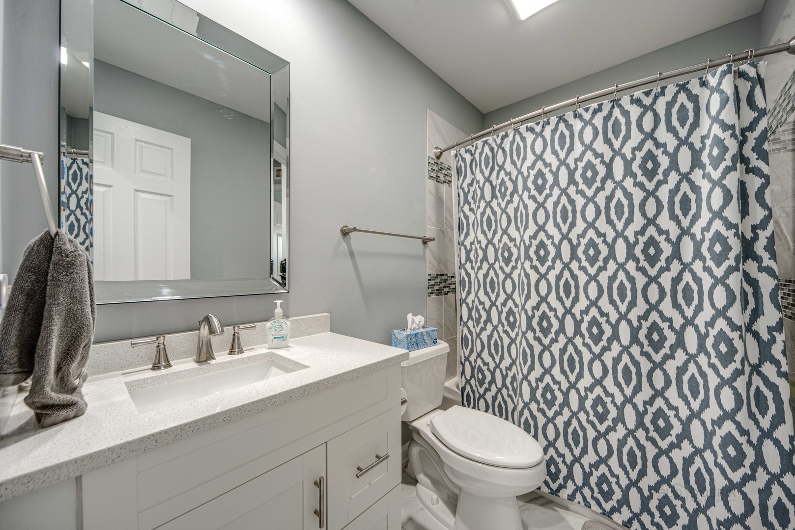 1603 Elm Street Spring Grove, IL 60081 - Photo 24 of 38 a bathroom with a granite countertop sink and a mirror