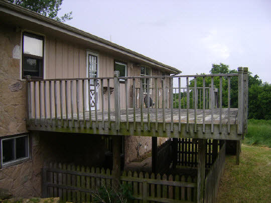 10142 South Center Road Durand, IL 61024 - Photo 3 of 11 a balcony with table and chairs