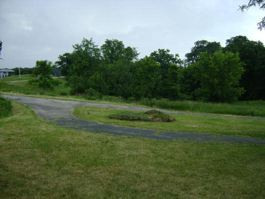 10142 South Center Road Durand, IL 61024 - Photo 4 of 11 a view of a grassy field with trees