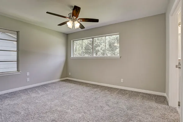 a view of an empty room with a window