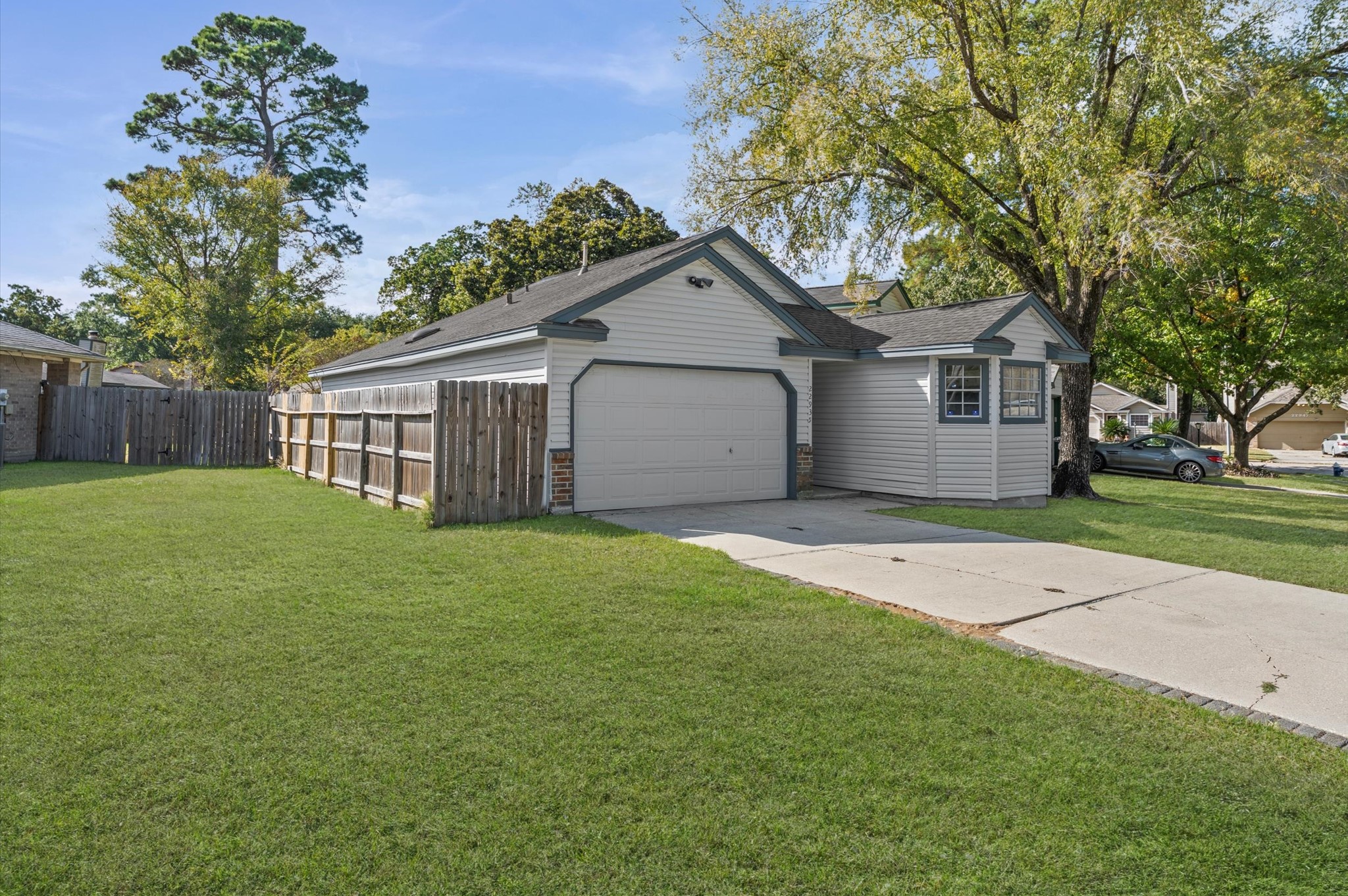 22935 Sherioaks Lane Spring, TX 77389 - Photo 4 of 22 a house view with a garden space
