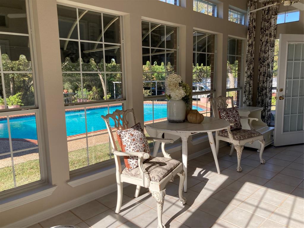 142 Hickory Valley Lane Waco, TX 76705 - Photo 13 of 33 a view of a dining room with furniture and floor to ceiling windows