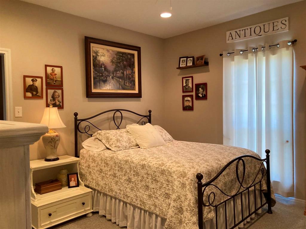 142 Hickory Valley Lane Waco, TX 76705 - Photo 17 of 33 a bedroom with a bed and a window