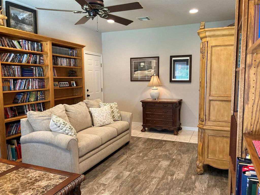 142 Hickory Valley Lane Waco, TX 76705 - Photo 18 of 33 a living room with furniture and a book shelf