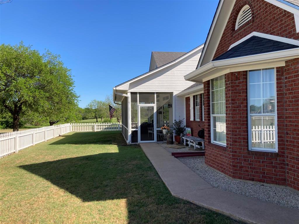 142 Hickory Valley Lane Waco, TX 76705 - Photo 20 of 33 a view of a house with sitting area and garden