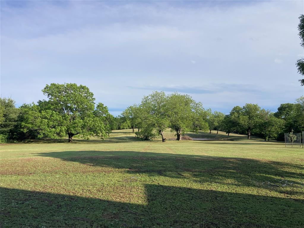 142 Hickory Valley Lane Waco, TX 76705 - Photo 2 of 33 a view of a golf course with a lake