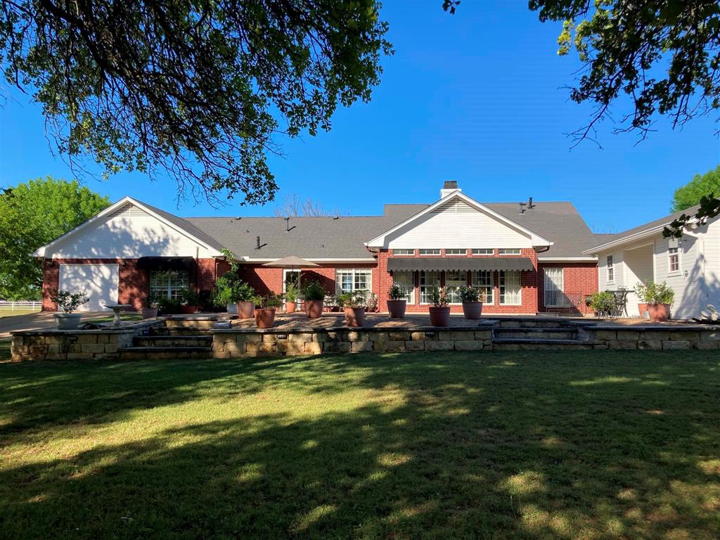 142 Hickory Valley Lane Waco, TX 76705 - Photo 23 of 33 a front view of a house with garden