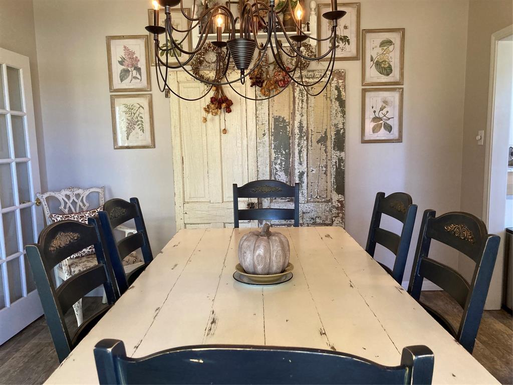 142 Hickory Valley Lane Waco, TX 76705 - Photo 5 of 33 a view of a dining room with furniture and wooden floor