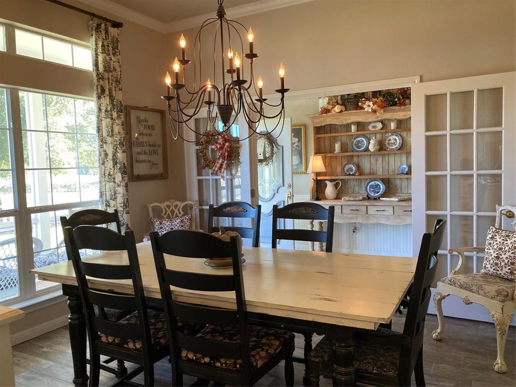 142 Hickory Valley Lane Waco, TX 76705 - Photo 6 of 33 a view of a dining room with furniture and chandelier