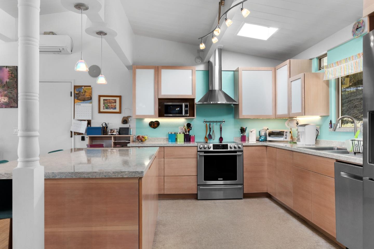 490 Amigo Road Soquel, CA 95073 - Photo 17 of 71 a kitchen with stainless steel appliances granite countertop a sink stove and refrigerator