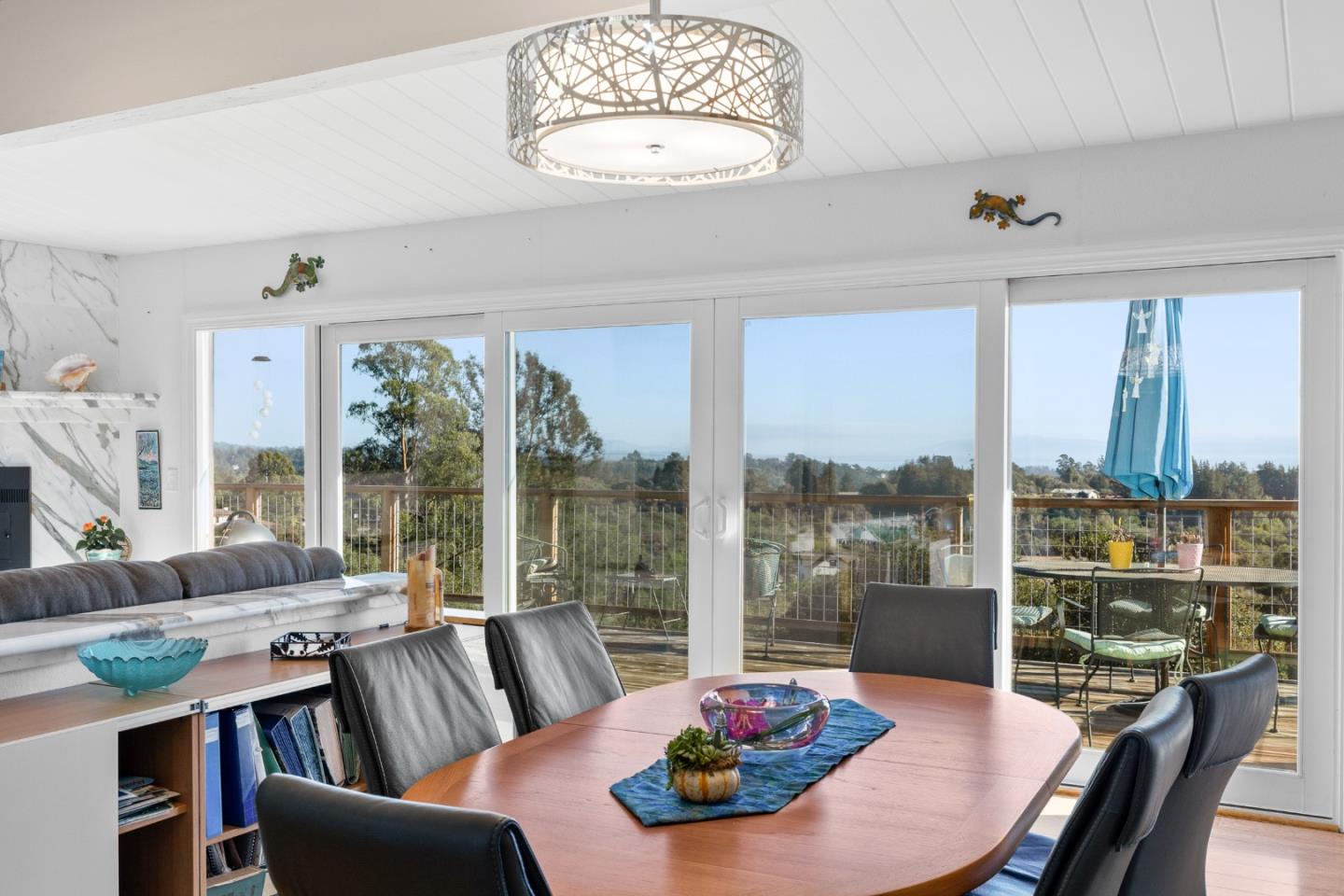 490 Amigo Road Soquel, CA 95073 - Photo 24 of 71 a view of a dining room with furniture large windows and wooden floor