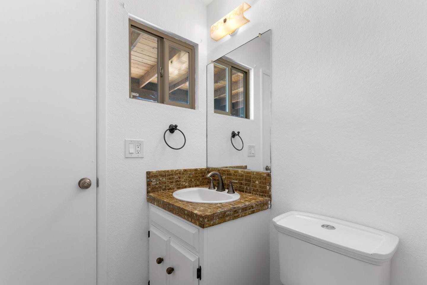 490 Amigo Road Soquel, CA 95073 - Photo 60 of 71 a bathroom with a sink a toilet and shower