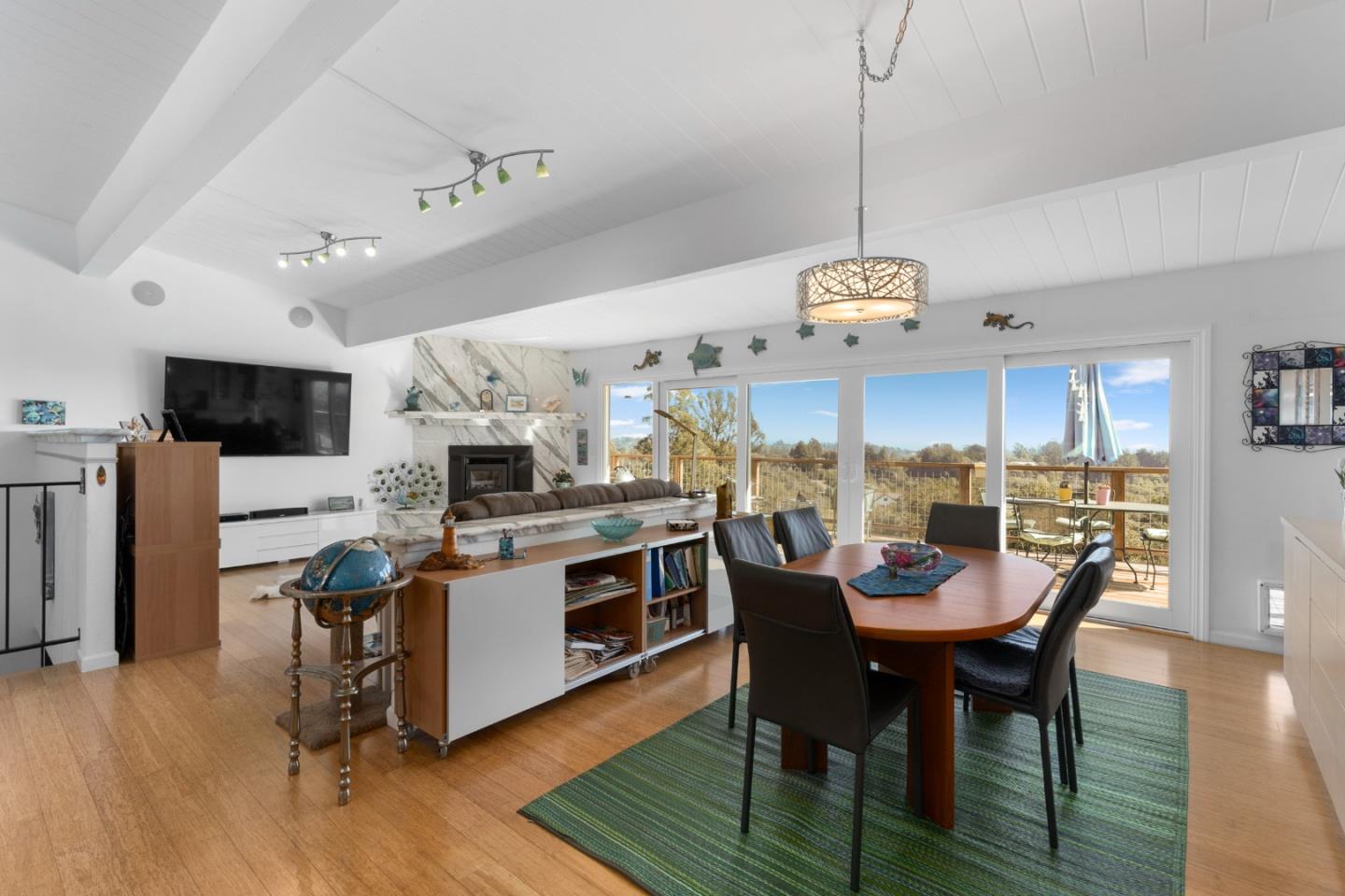 490 Amigo Road Soquel, CA 95073 - Photo 7 of 71 a view of a dining room and livingroom with furniture wooden floor a chandelier