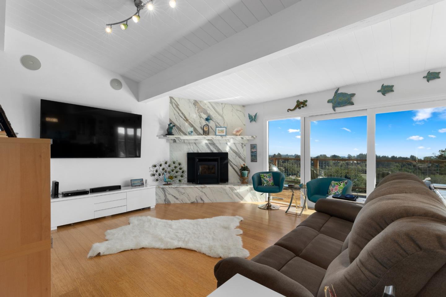 490 Amigo Road Soquel, CA 95073 - Photo 9 of 71 a living room with furniture a fireplace and a flat screen tv