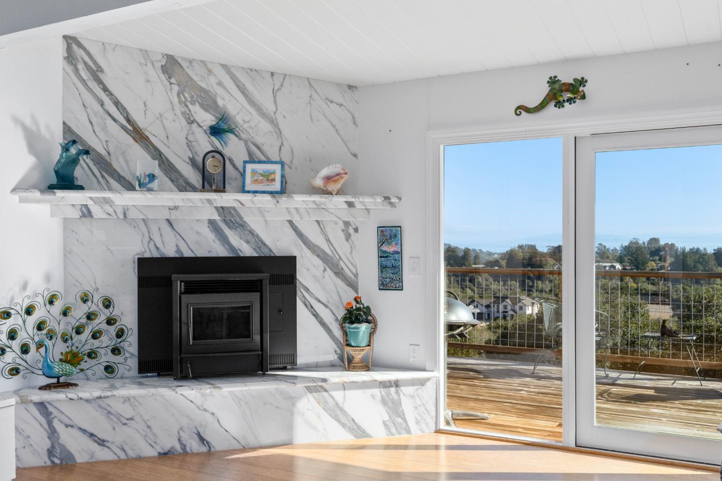 490 Amigo Road Soquel, CA 95073 - Photo 10 of 71 a living room with a fireplace and a floor to ceiling window