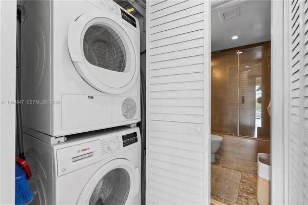 a utility room with dryer and washer