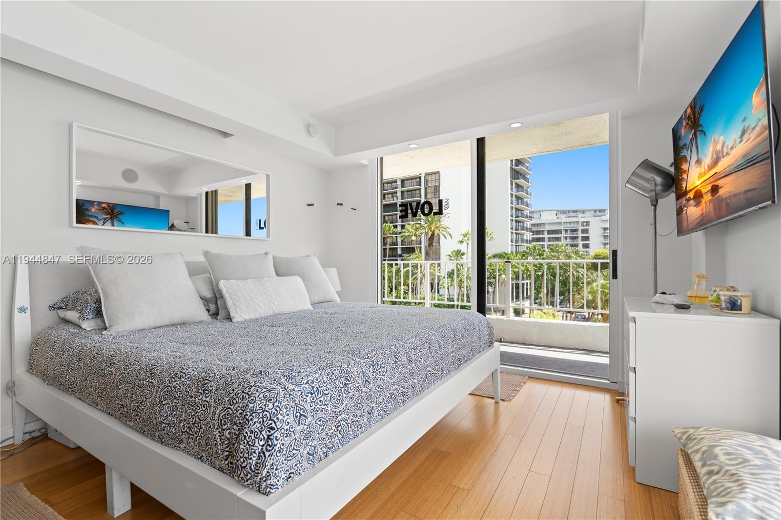 200 Southeast 15th Road, Unit 5D Miami, FL 33129 - Photo 17 of 25 a bedroom with a large bed and a large window