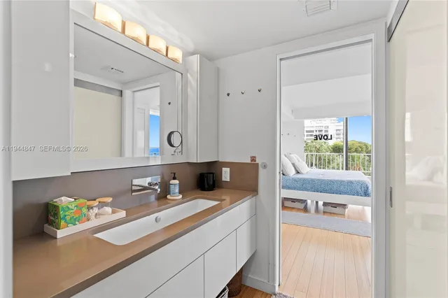 a bathroom with a sink and a mirror