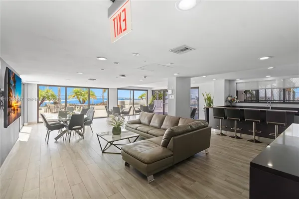 a room with lots of gym equipment and windows