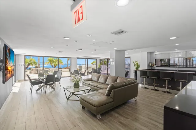 a room with lots of gym equipment and windows