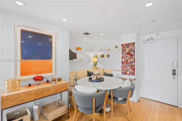 a dining room with furniture and window