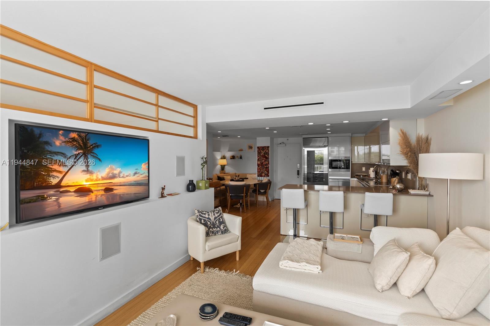 200 Southeast 15th Road, Unit 5D Miami, FL 33129 - Photo 10 of 25 a living room with furniture and a flat screen tv