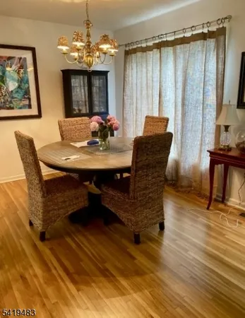 a view of a dining room with furniture and window