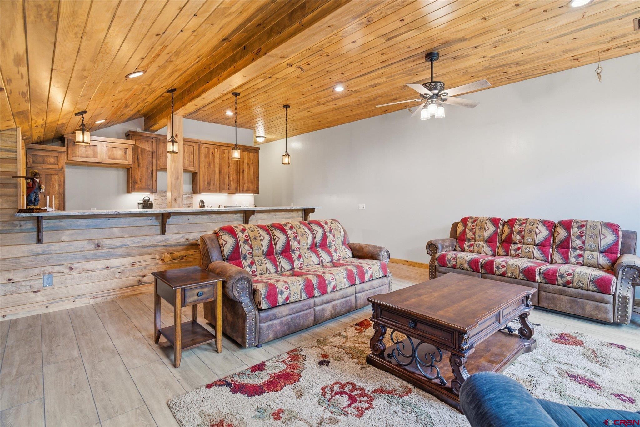 197 Hummingbird Way Bayfield, CO 81122 - Photo 32 of 44 a living room with a couch and a table