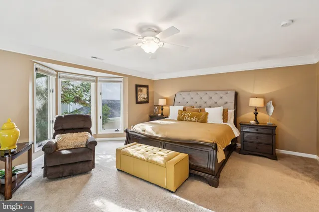 a spacious bathroom with a tub double sink and mirror