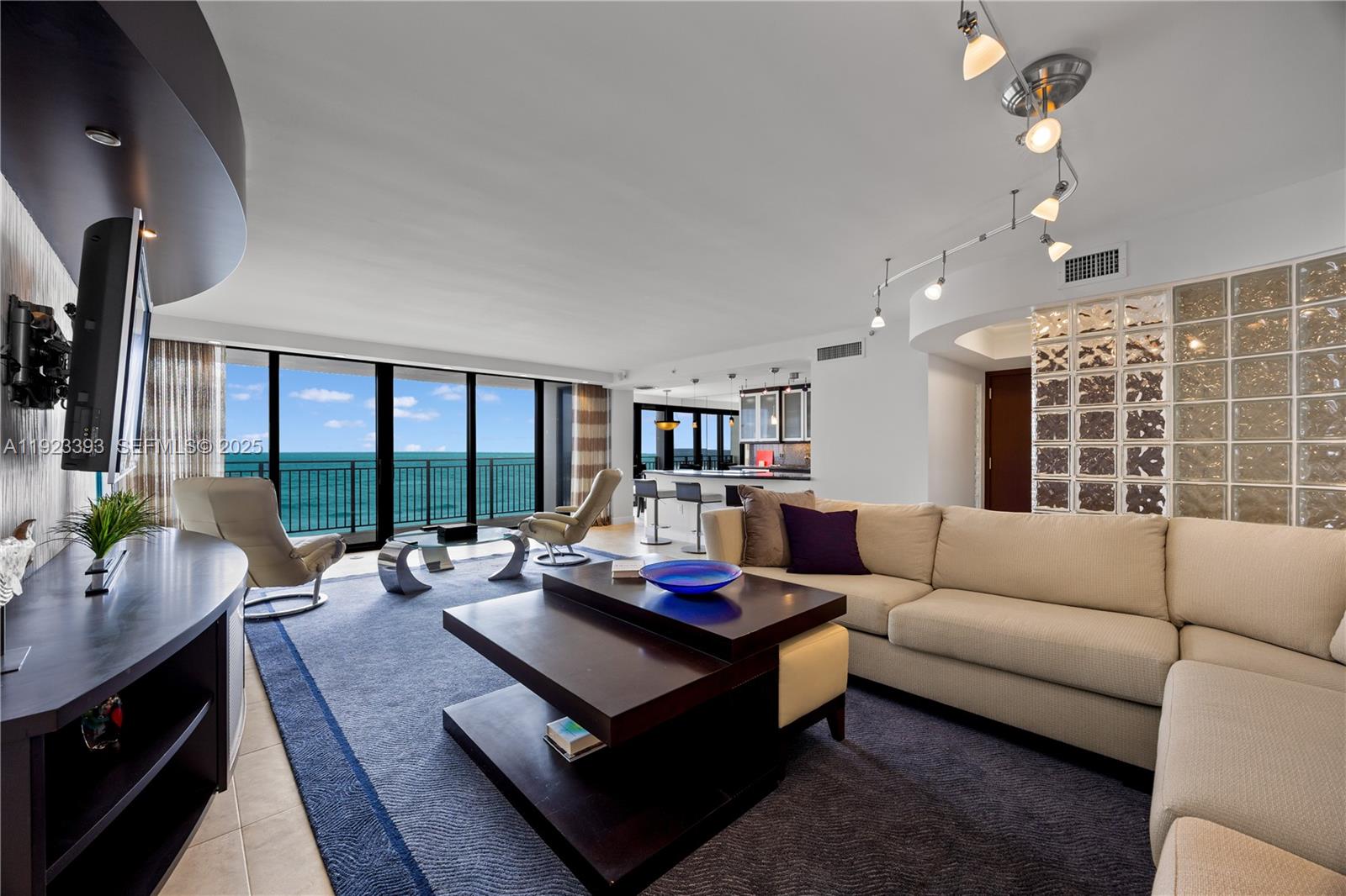 1800 South Ocean Boulevard, Unit 5C Boca Raton, FL 33432 - Photo 11 of 98 a living room with furniture and a large window