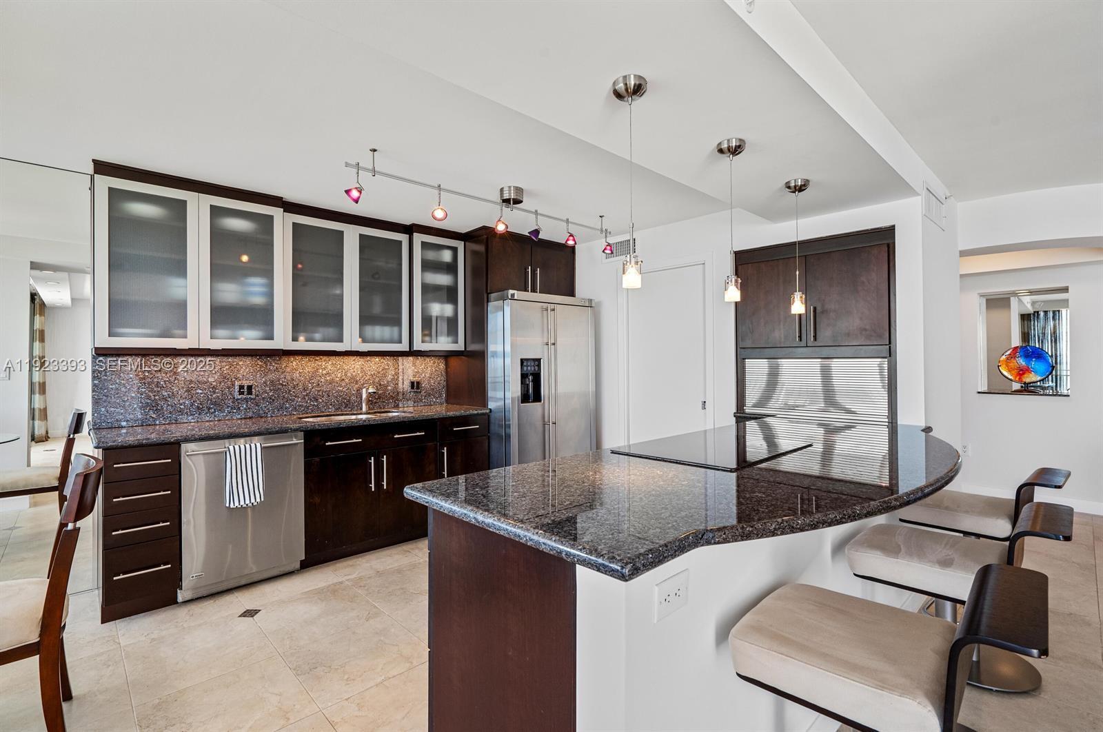 1800 South Ocean Boulevard, Unit 5C Boca Raton, FL 33432 - Photo 13 of 98 a kitchen with stainless steel appliances granite countertop a stove and a sink