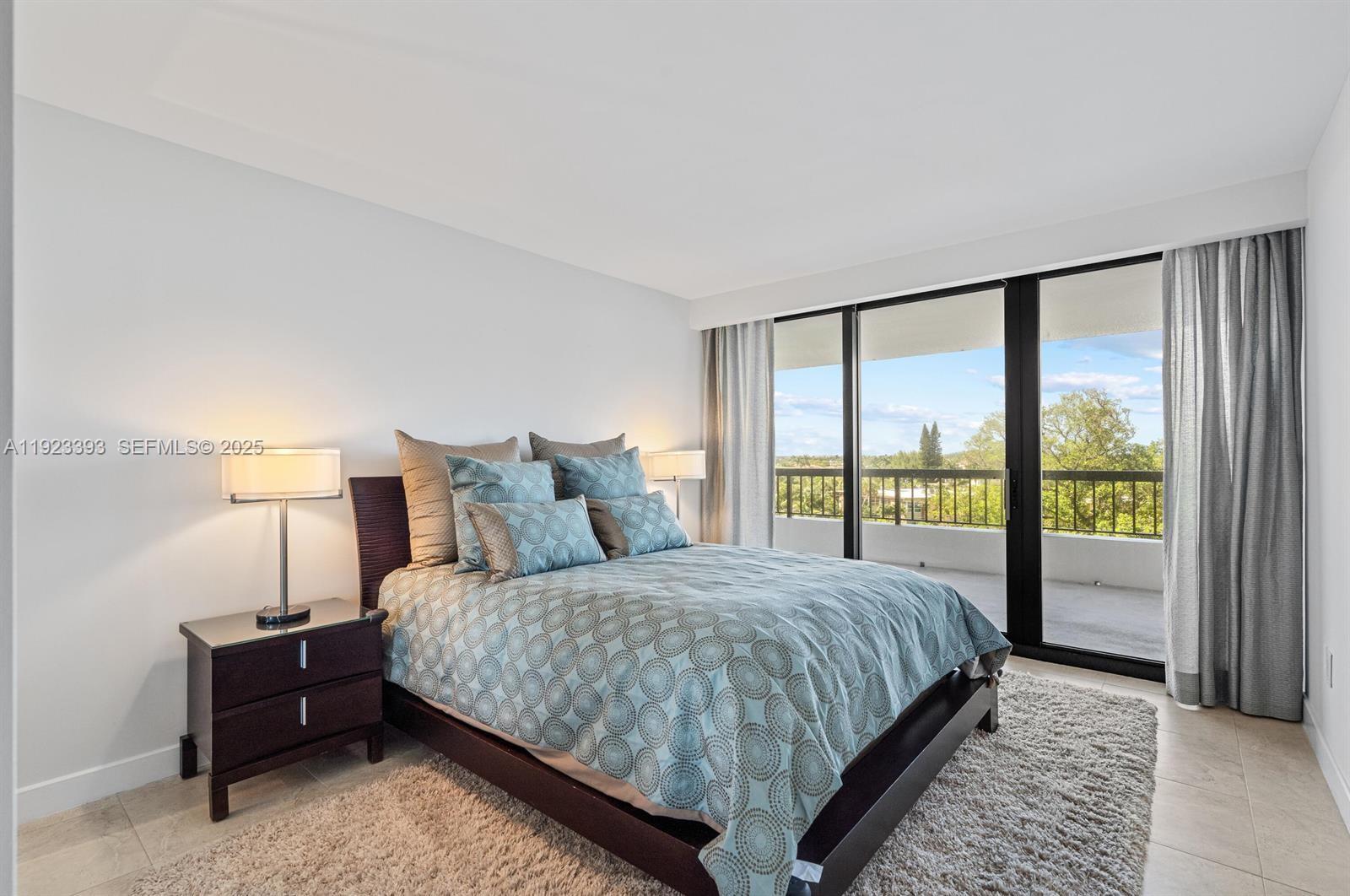 1800 South Ocean Boulevard, Unit 5C Boca Raton, FL 33432 - Photo 21 of 98 a bedroom with a large bed and a large window