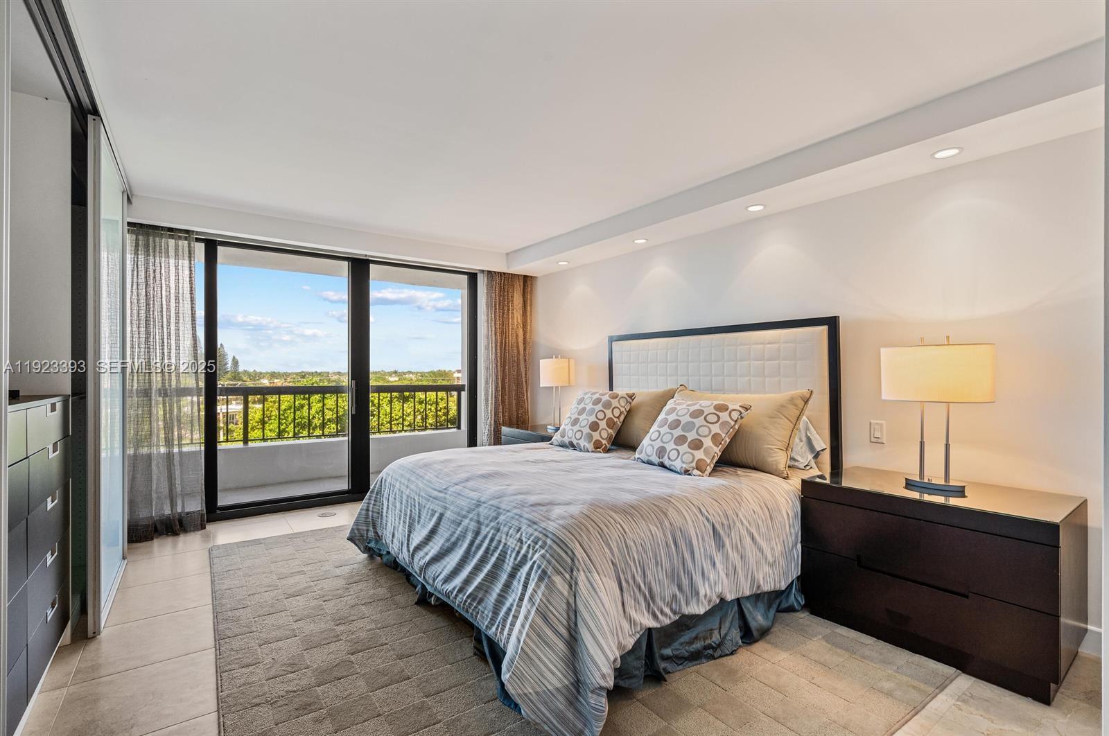 1800 South Ocean Boulevard, Unit 5C Boca Raton, FL 33432 - Photo 22 of 98 a bedroom with a large bed and a large window
