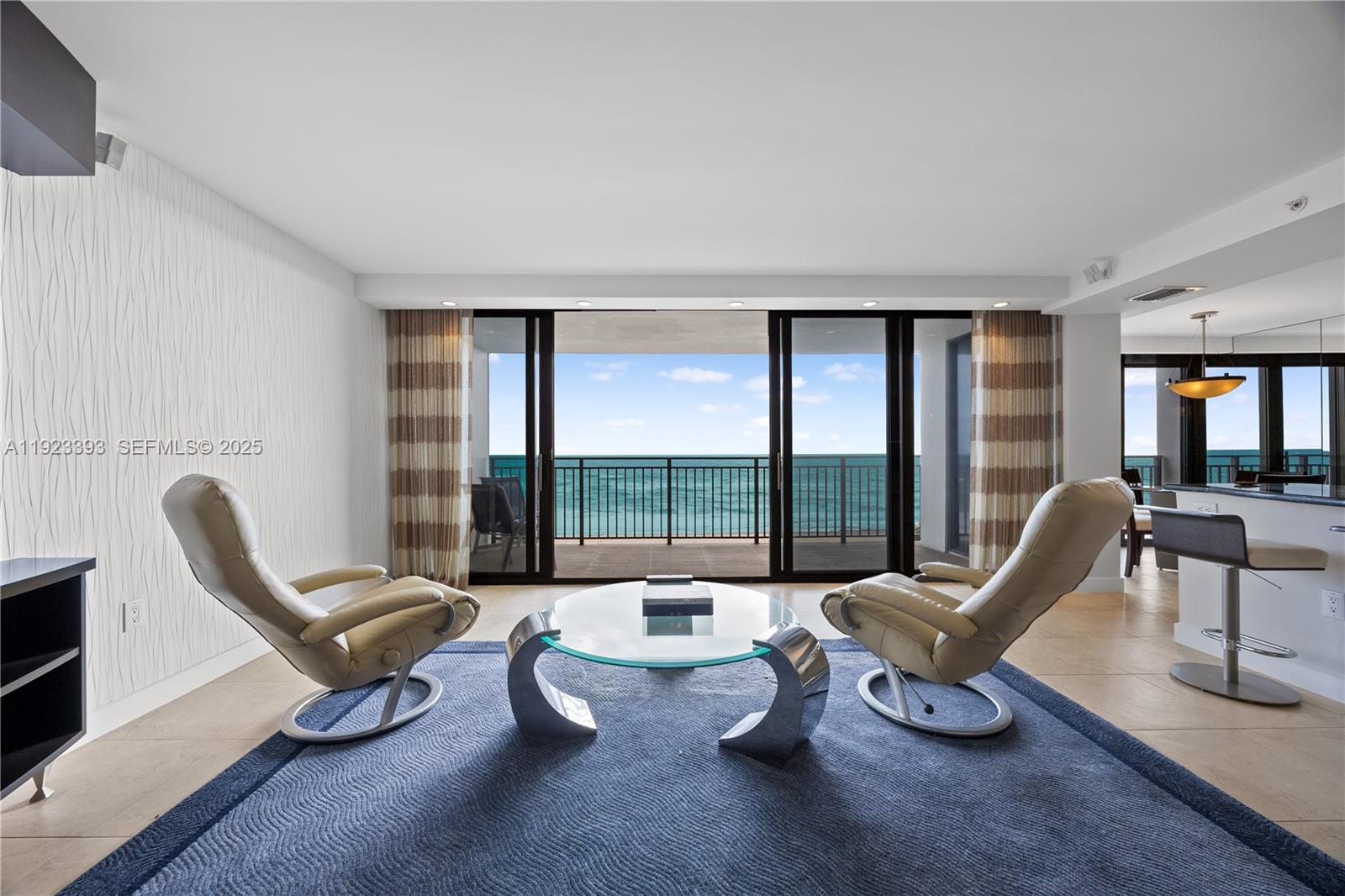 1800 South Ocean Boulevard, Unit 5C Boca Raton, FL 33432 - Photo 23 of 98 a living room with furniture and a large window