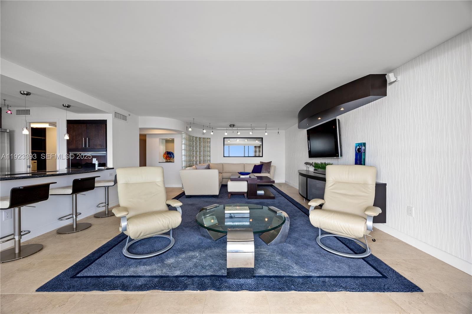 1800 South Ocean Boulevard, Unit 5C Boca Raton, FL 33432 - Photo 30 of 98 a living room with furniture and a flat screen tv