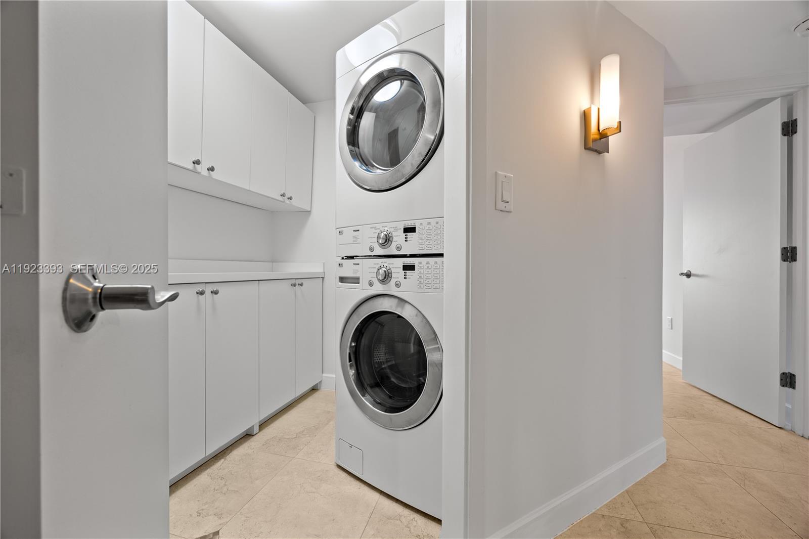 1800 South Ocean Boulevard, Unit 5C Boca Raton, FL 33432 - Photo 32 of 98 a utility room with dryer and washer