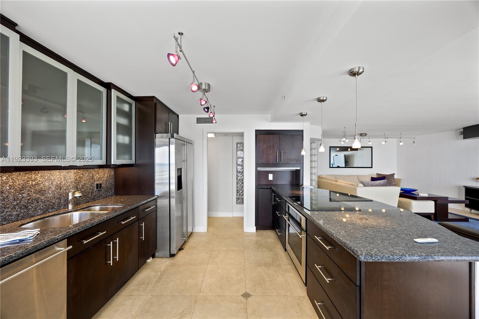 1800 South Ocean Boulevard, Unit 5C Boca Raton, FL 33432 - Photo 34 of 98 a kitchen with stainless steel appliances granite countertop a sink stove and refrigerator