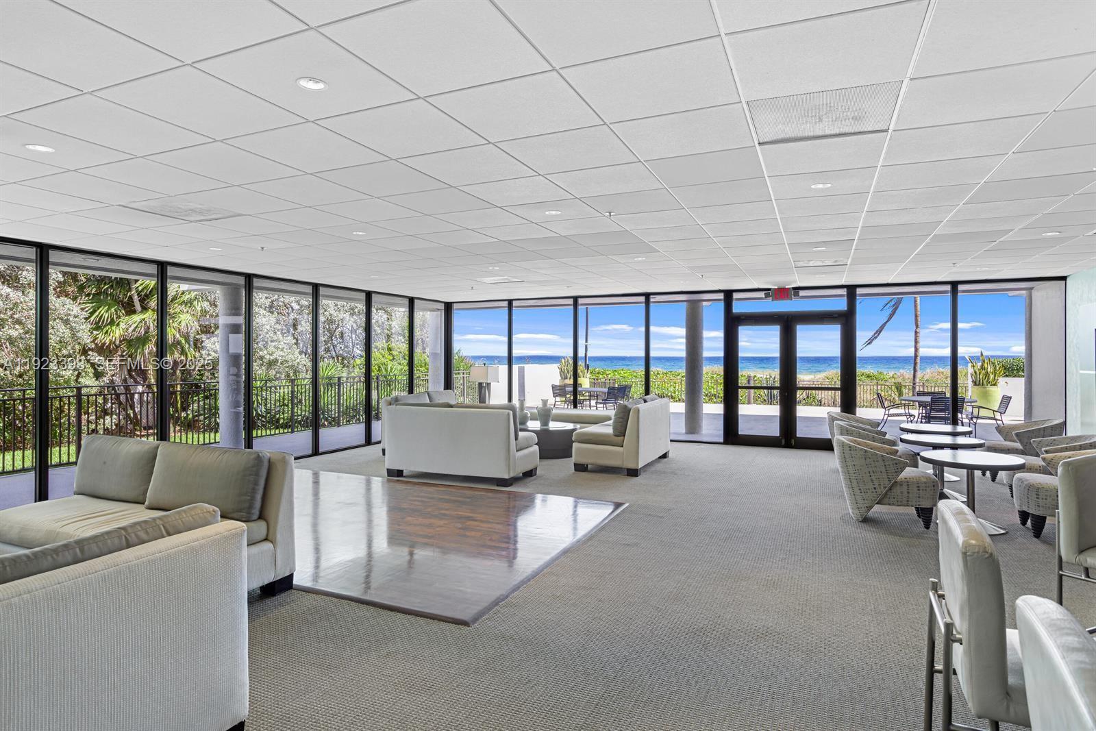 1800 South Ocean Boulevard, Unit 5C Boca Raton, FL 33432 - Photo 38 of 98 a living room with furniture and a large window